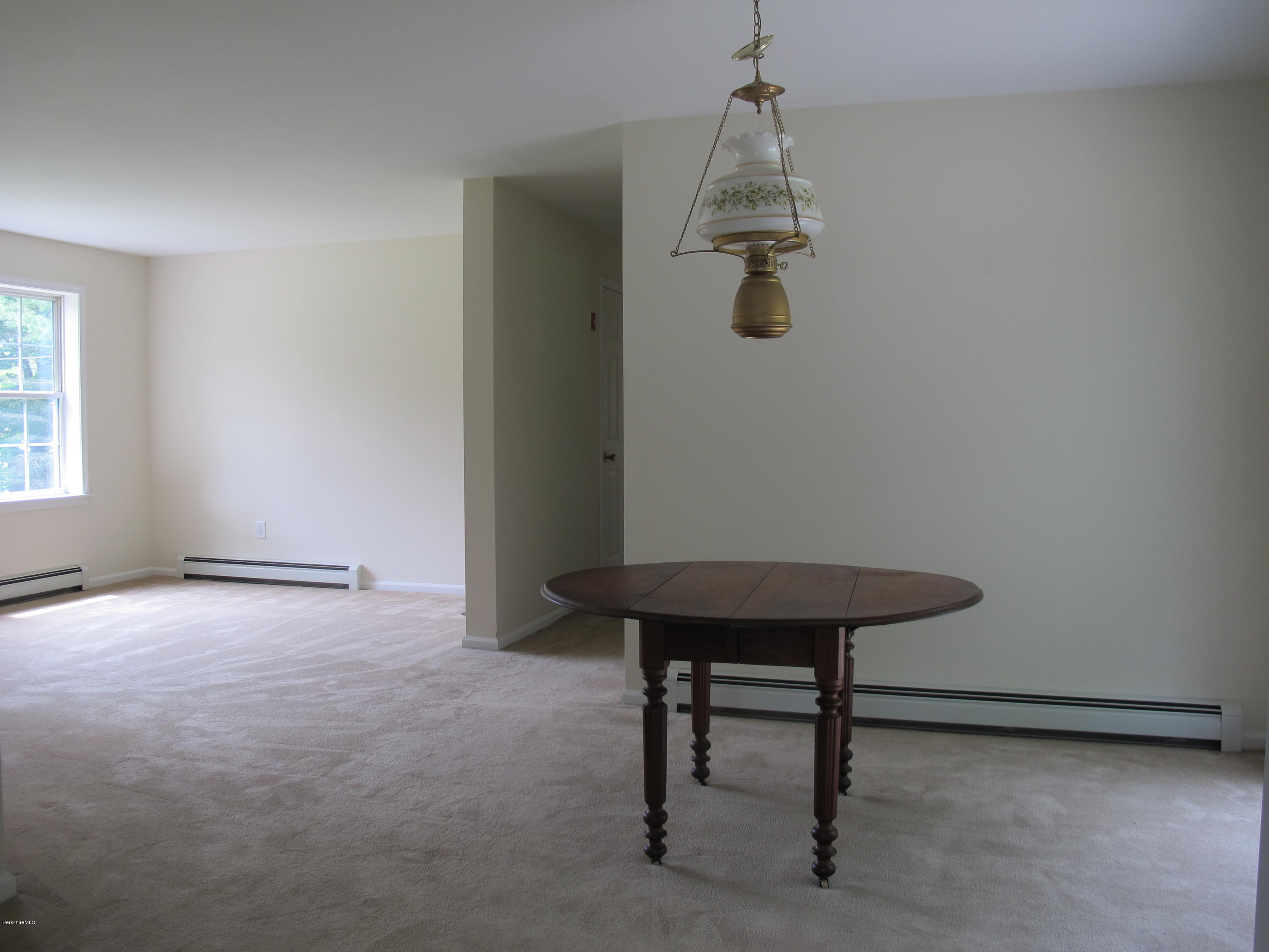 54 Salisbury Road Sheffield, MA 01257 - Photo 6 of 27 a view of a room with a table chair and wooden floor