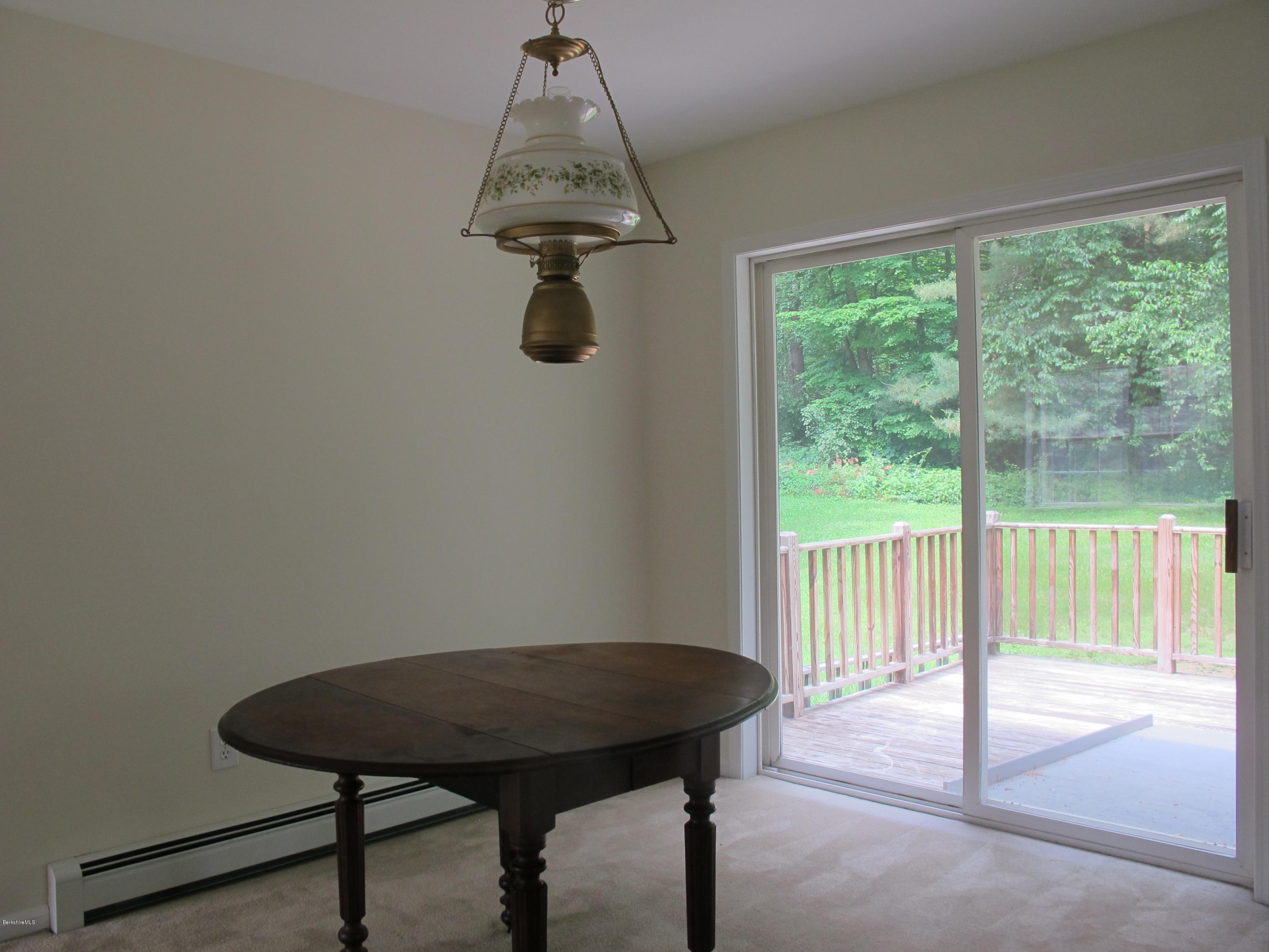 54 Salisbury Road Sheffield, MA 01257 - Photo 7 of 27 a view of a room with a table and chairs