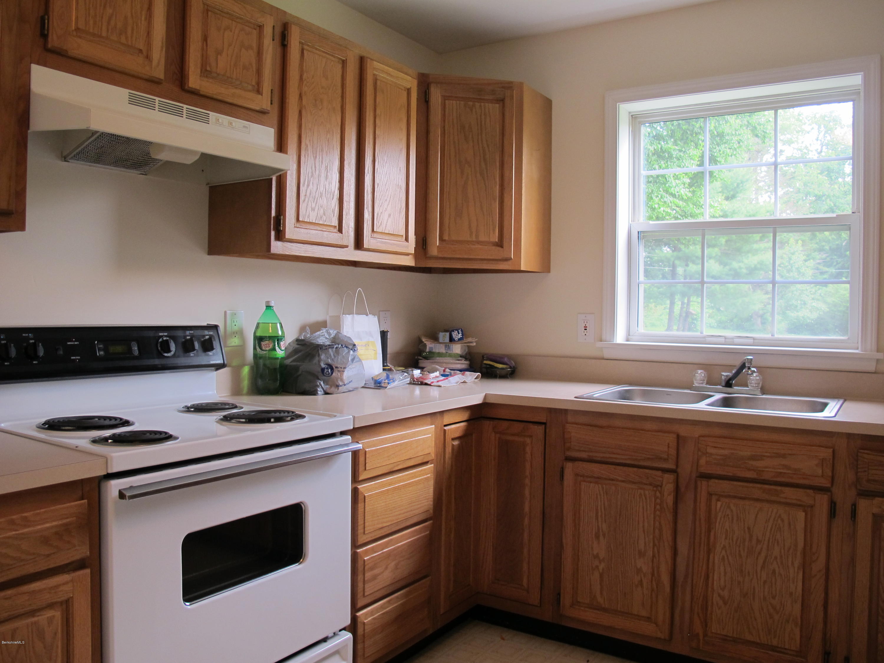 54 Salisbury Road Sheffield, MA 01257 - Photo 9 of 27 a kitchen with stainless steel appliances granite countertop a sink a stove and cabinets