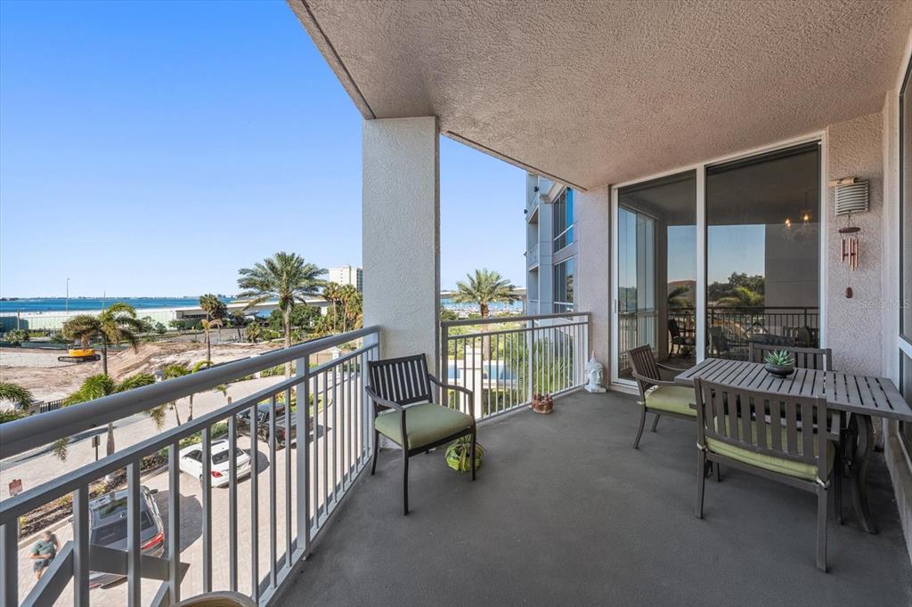 331 Cleveland Street, Unit 301 Clearwater, FL 33755 - Photo 26 of 39 a balcony with furniture and water view