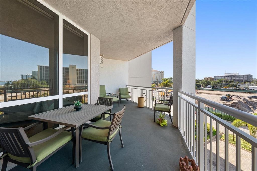 331 Cleveland Street, Unit 301 Clearwater, FL 33755 - Photo 28 of 39 a balcony with chairs and a table