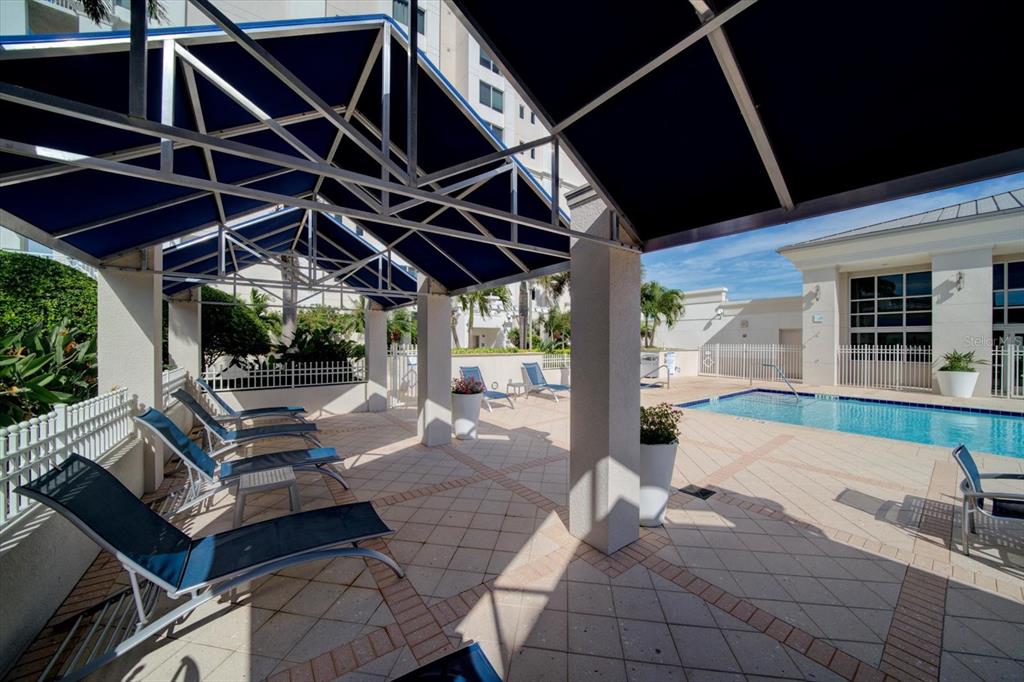 331 Cleveland Street, Unit 301 Clearwater, FL 33755 - Photo 34 of 39 a roof deck with table and chairs