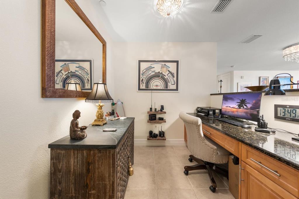 331 Cleveland Street, Unit 301 Clearwater, FL 33755 - Photo 5 of 39 a view of a workspace with furniture and a window