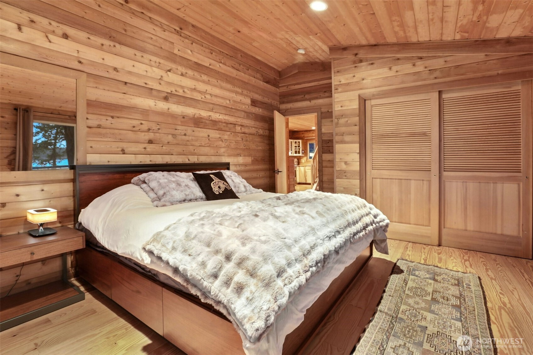 5 Smugglers Cove Road Friday Harbor, WA 98250 - Photo 11 of 36 a bed sitting in a bedroom next to a window