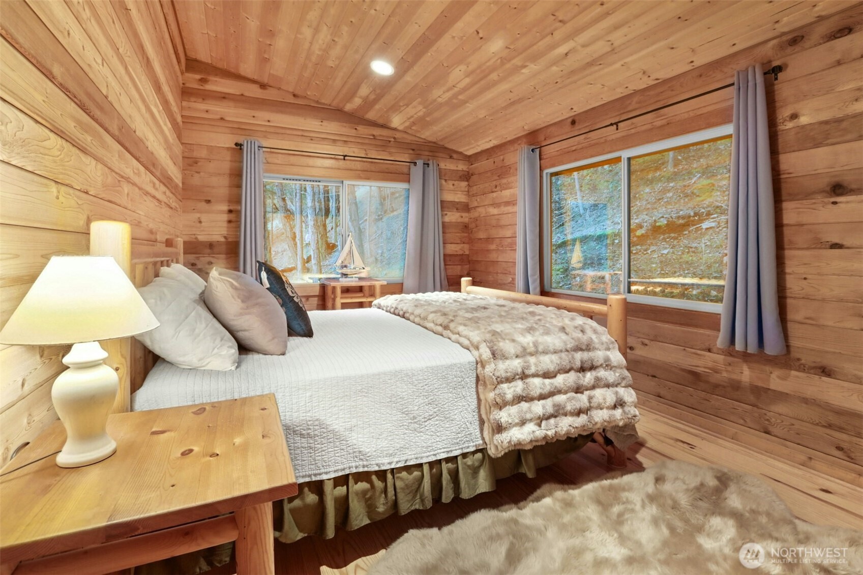 5 Smugglers Cove Road Friday Harbor, WA 98250 - Photo 13 of 36 a bed sitting in a bedroom next to a window