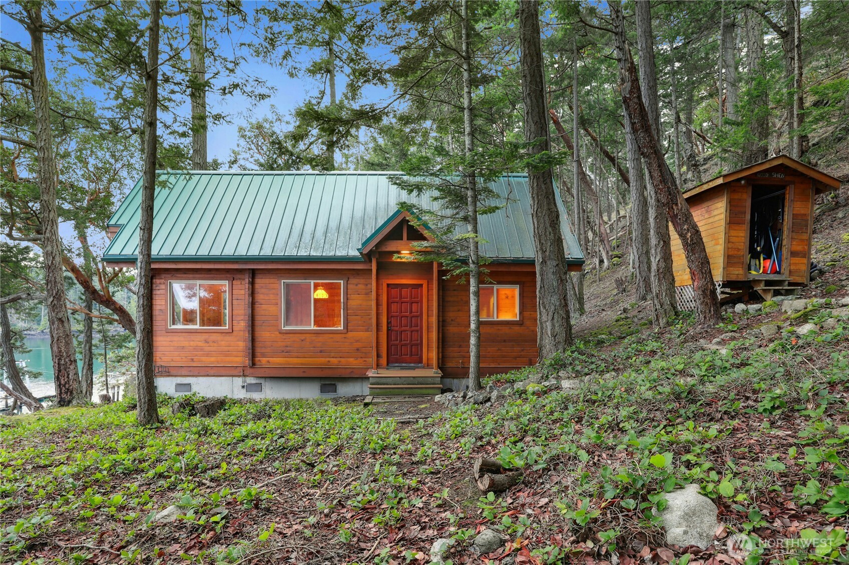 5 Smugglers Cove Road Friday Harbor, WA 98250 - Photo 2 of 36 a front view of a house with garden