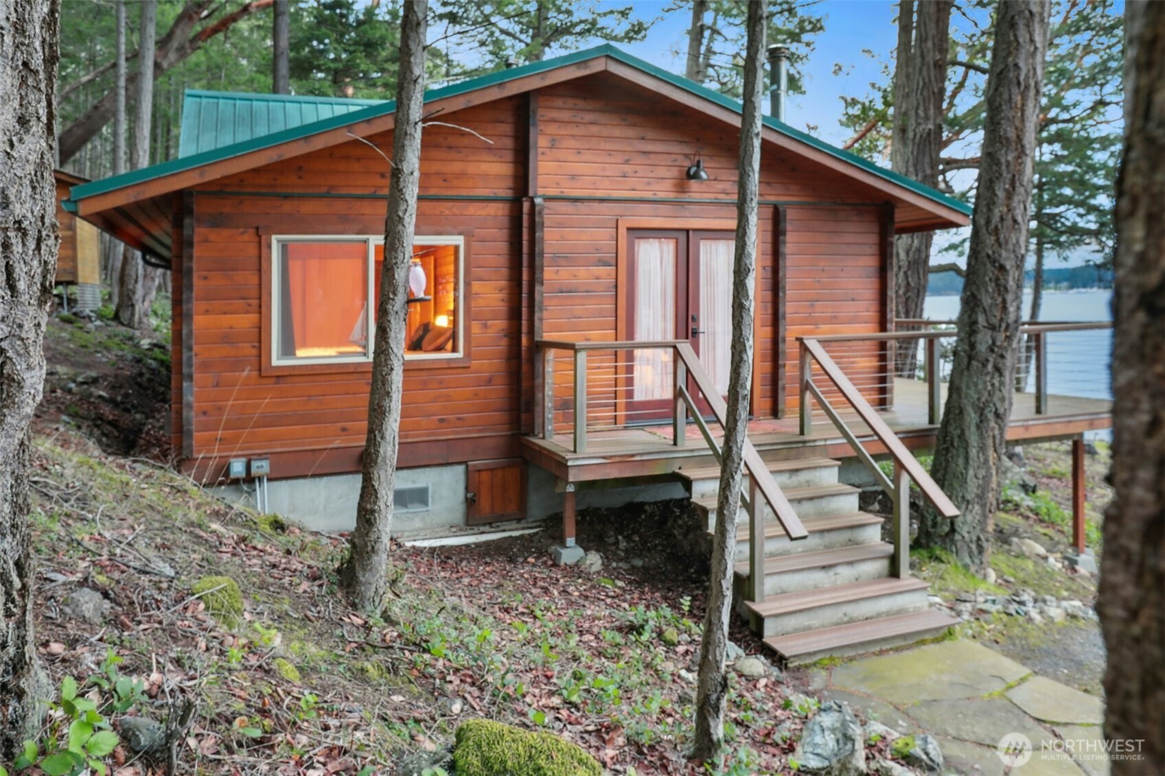5 Smugglers Cove Road Friday Harbor, WA 98250 - Photo 21 of 36 a front view of a house with stairs yard