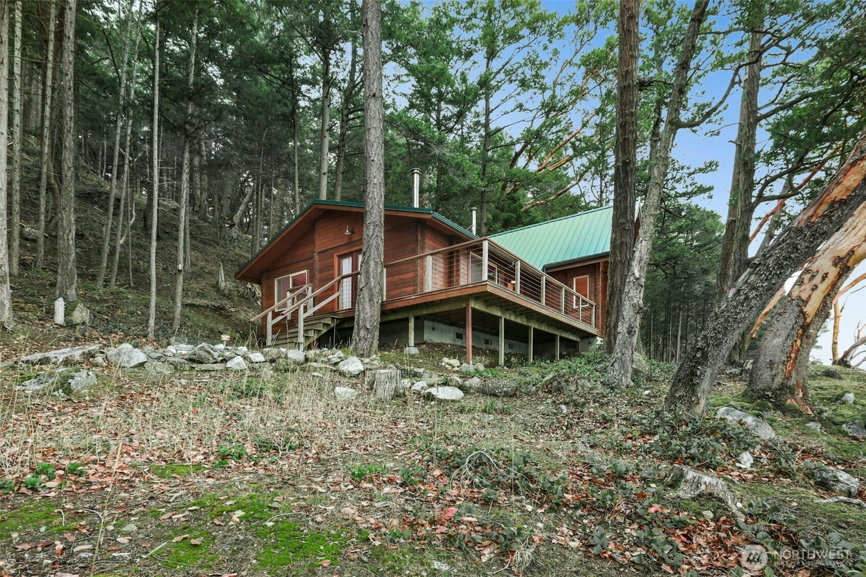 5 Smugglers Cove Road Friday Harbor, WA 98250 - Photo 22 of 36 a backyard of a house with lots of green space