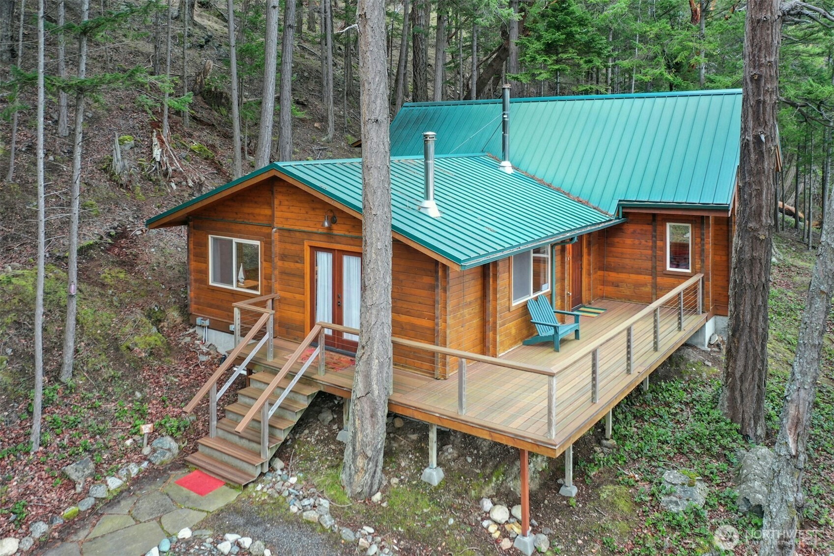 5 Smugglers Cove Road Friday Harbor, WA 98250 - Photo 24 of 36 a front view of a house with a yard