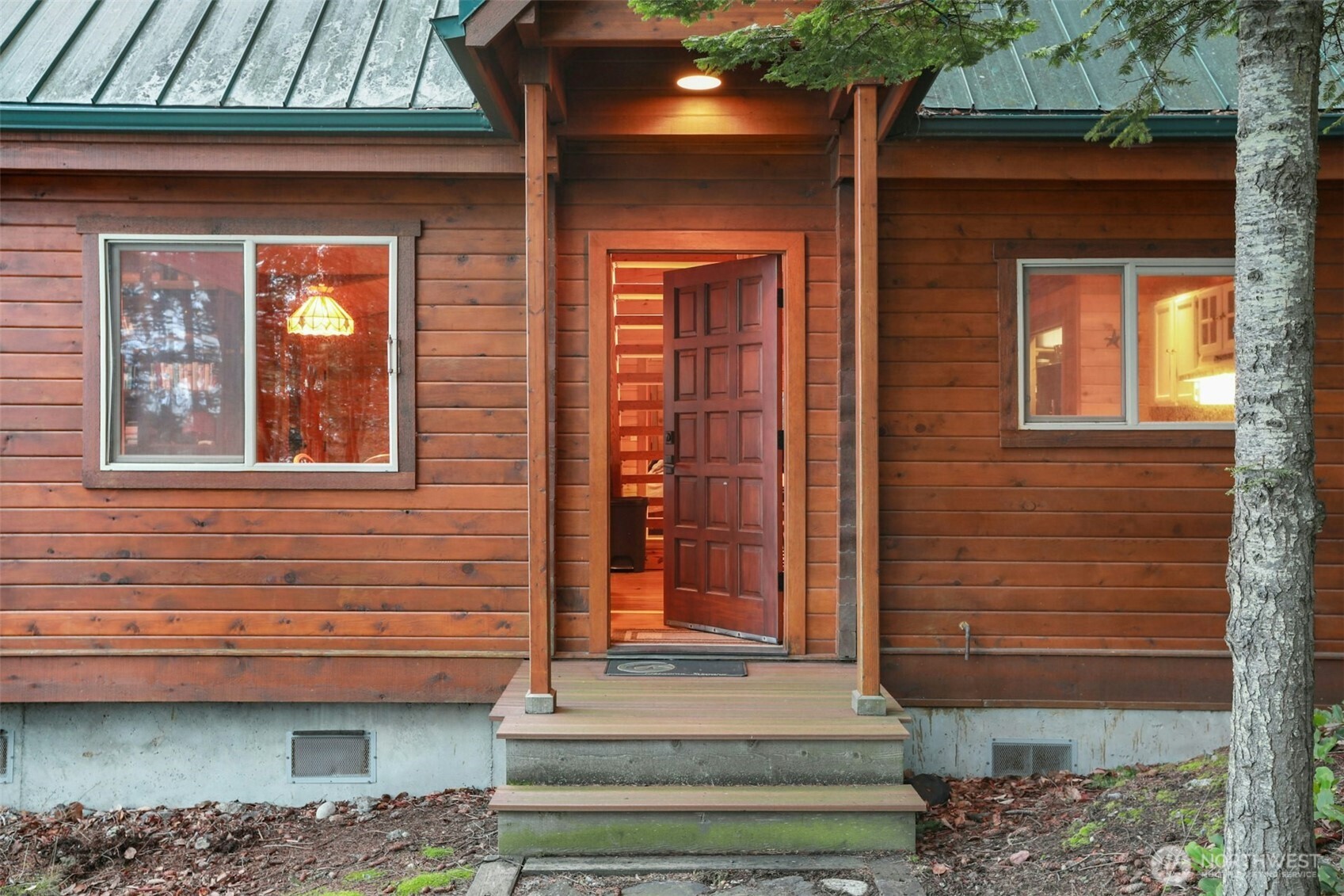 5 Smugglers Cove Road Friday Harbor, WA 98250 - Photo 3 of 36 a front view of a house with a garden