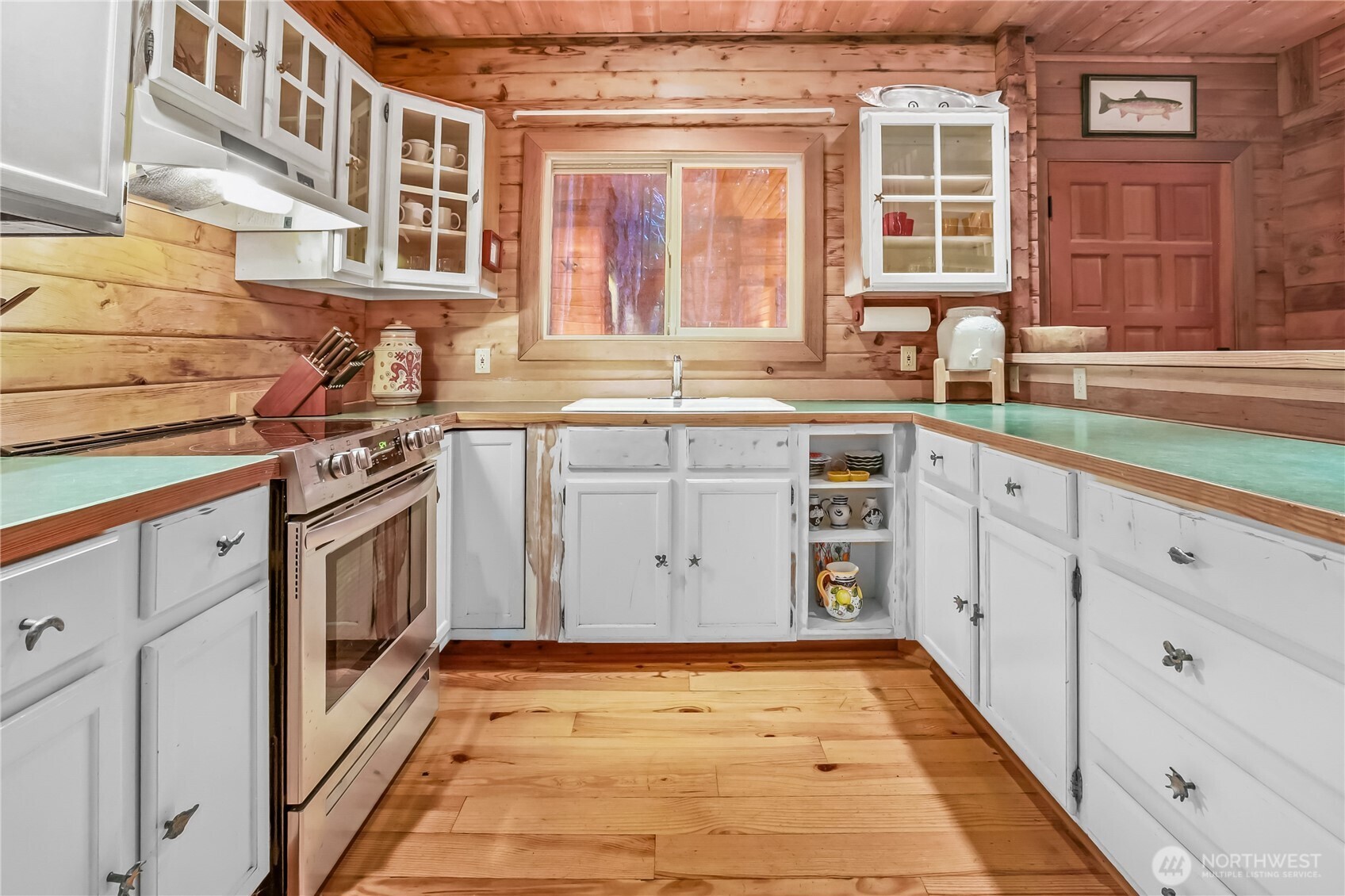 5 Smugglers Cove Road Friday Harbor, WA 98250 - Photo 8 of 36 a kitchen with stainless steel appliances granite countertop a stove and a sink