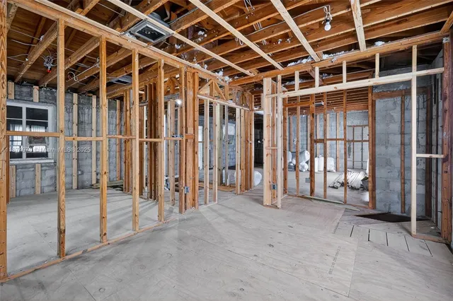 a view of an empty room with wooden frame