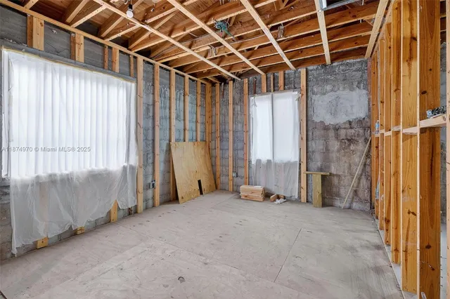 a view of an empty room with a balcony