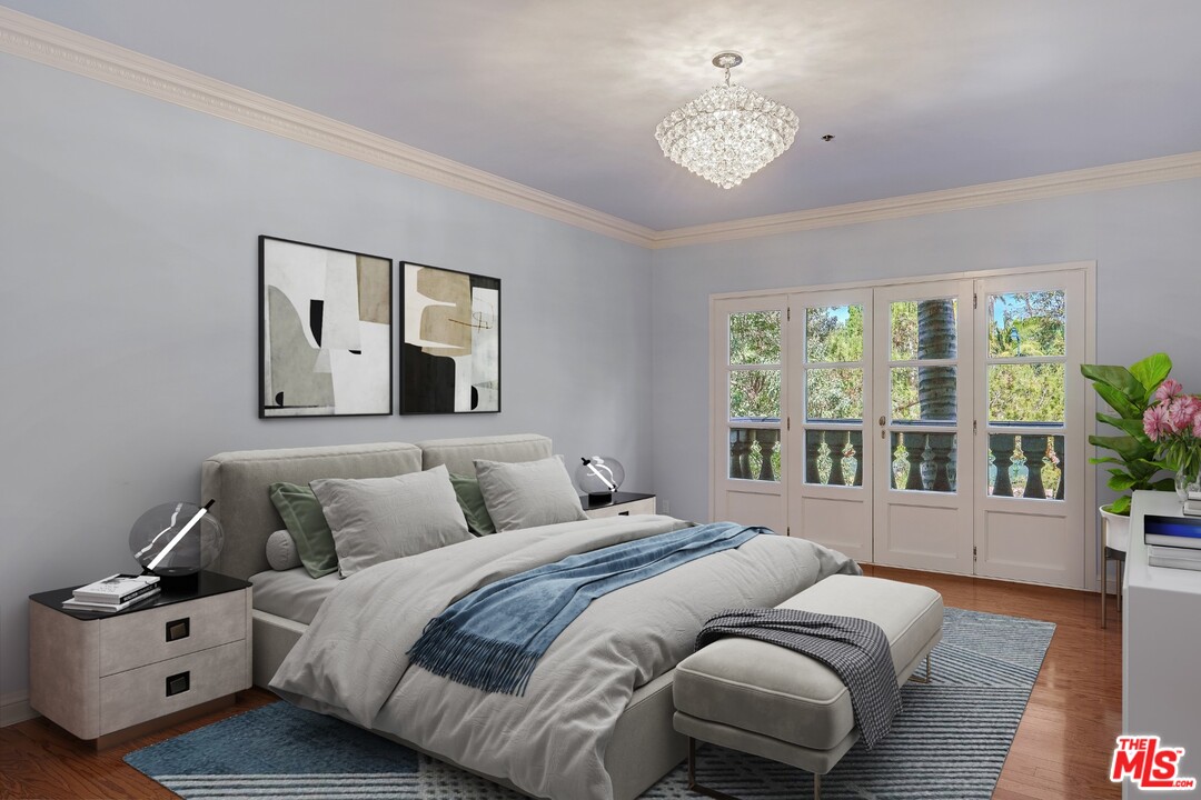 425 North Maple Drive, Unit 304 Beverly Hills, CA 90210 - Photo 17 of 26 a bedroom with a large bed and a window