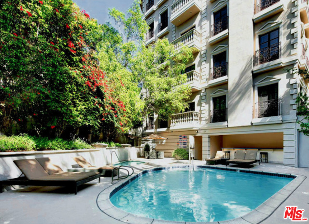 425 North Maple Drive, Unit 304 Beverly Hills, CA 90210 - Photo 23 of 26 a view of a swimming pool with a patio