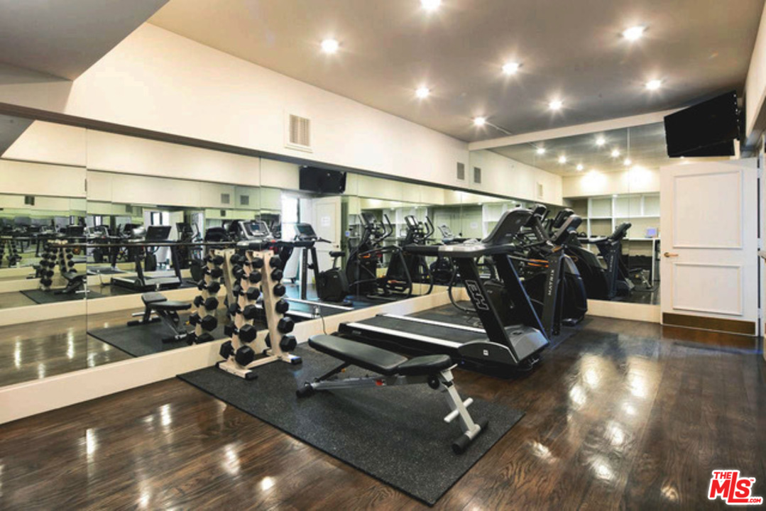 425 North Maple Drive, Unit 304 Beverly Hills, CA 90210 - Photo 25 of 26 a view of a room with gym equipment