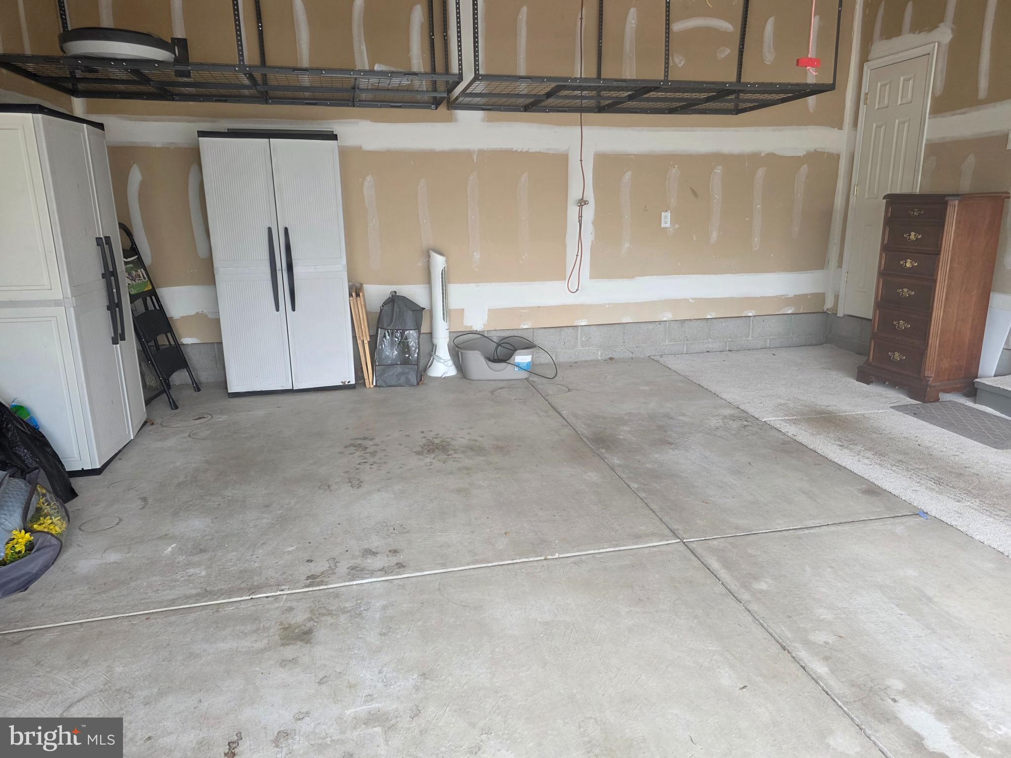 1105 Hulnick Road, Unit 43877 Coatesville, PA 19320 - Photo 33 of 38 Large 2 car garage with storage shelves