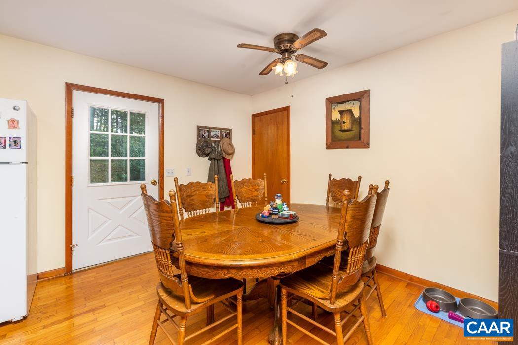 113 Plum Tree Draft Road Churchville, VA 24421 - Photo 10 of 43 a view of a dining room with furniture and a chandelier