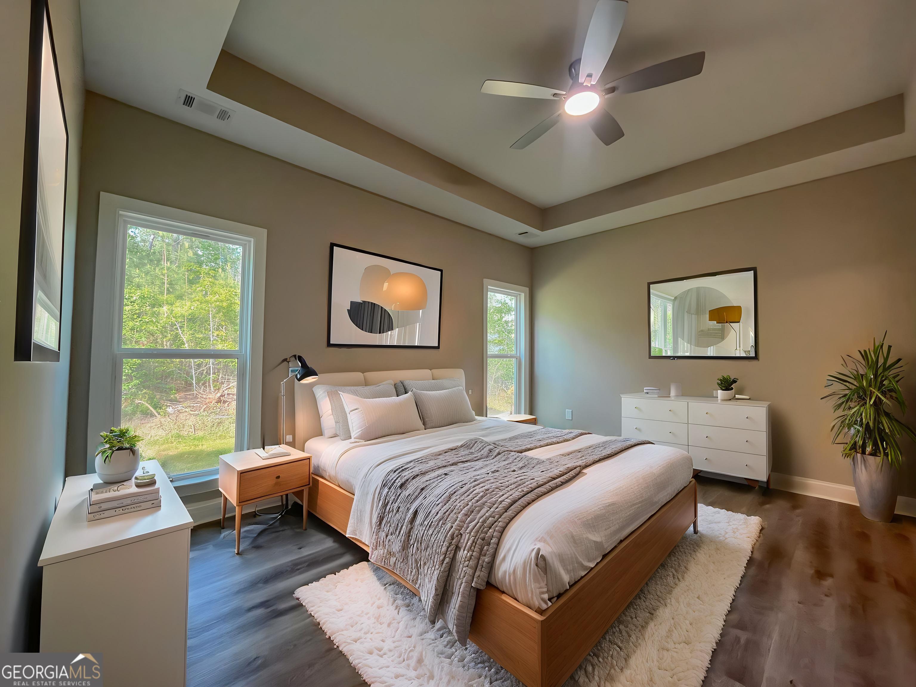 711 Flanders Lane Dublin, GA 31021 - Photo 20 of 49 a bedroom with a large bed couch and a window