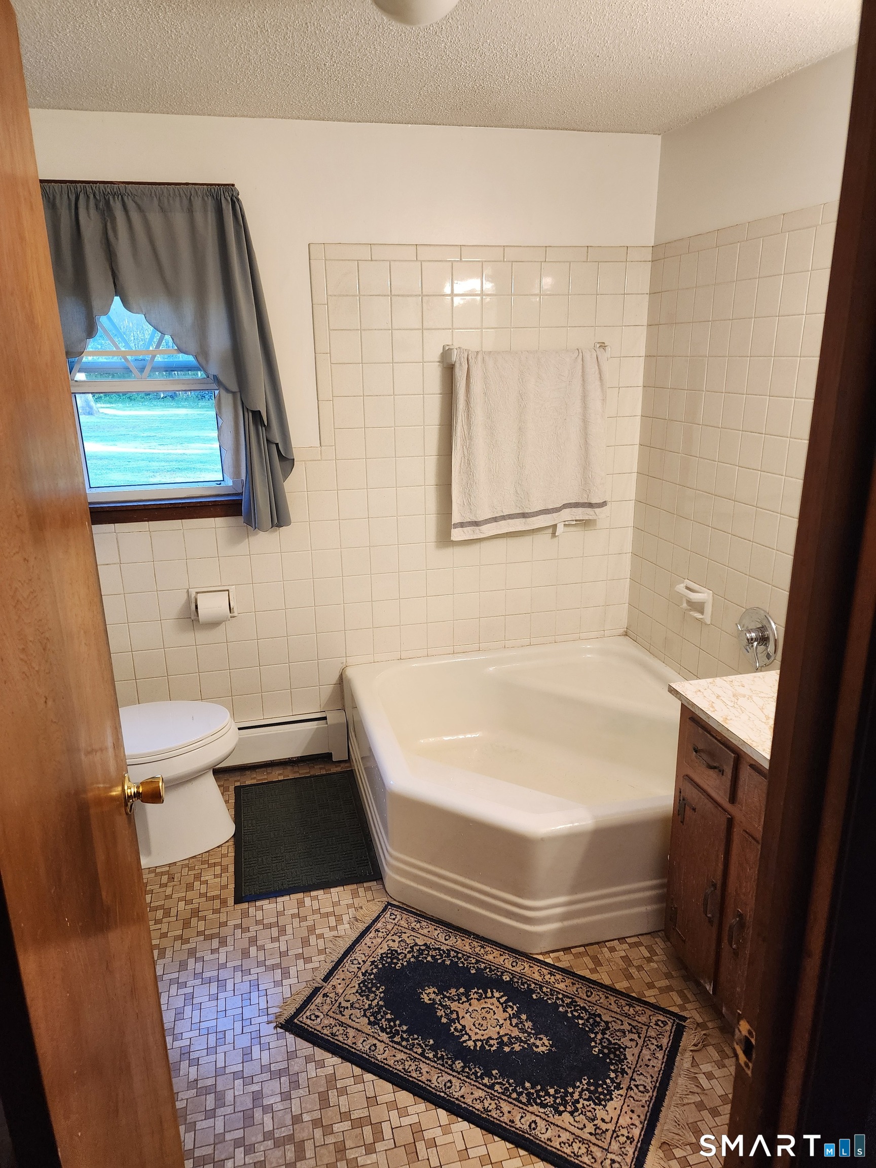 312 Gehring Road Tolland, CT 06084 - Photo 11 of 30 a bathroom with a toilet a sink and mirror