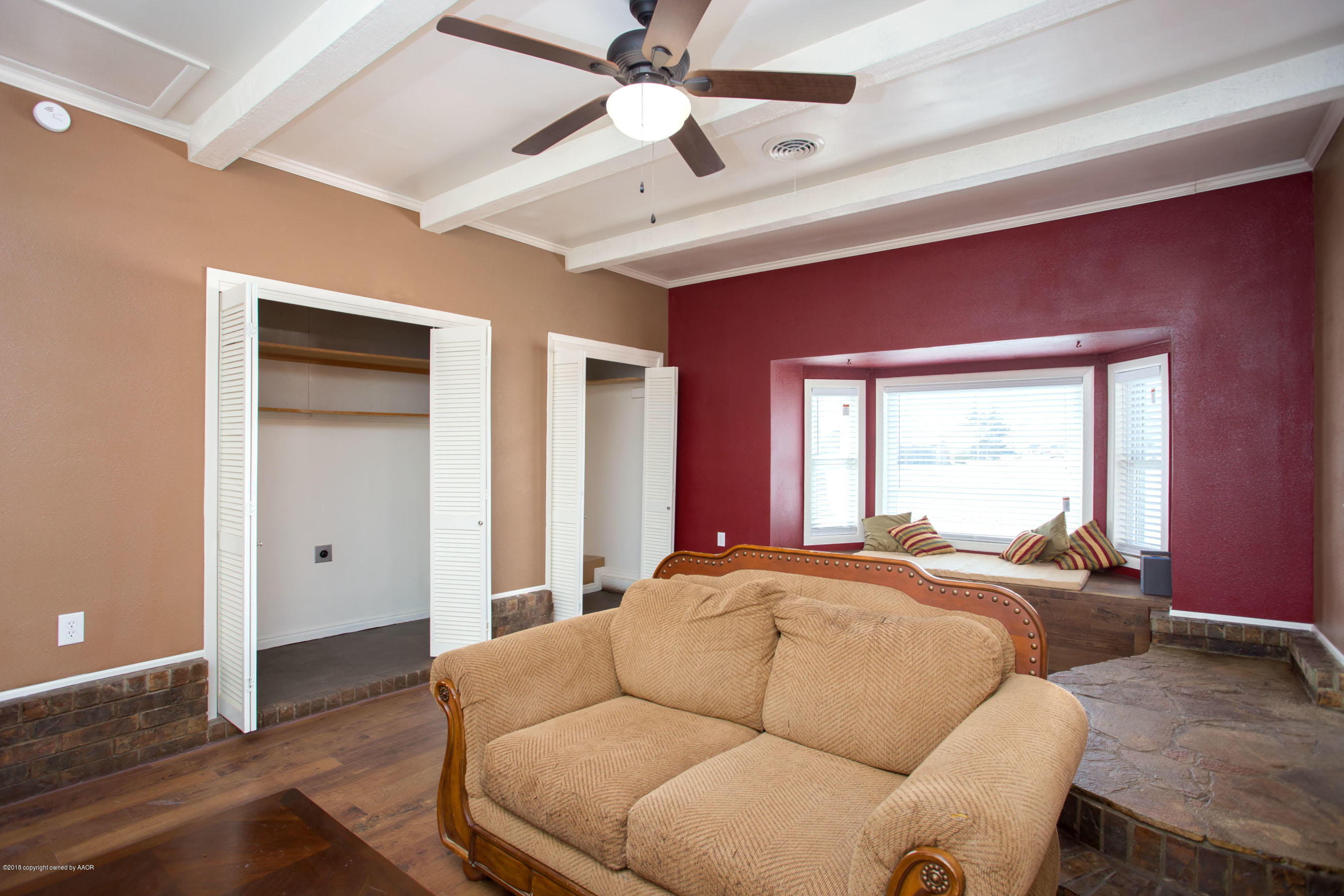 4609 South Bryan Street Amarillo, TX 79110 - Photo 12 of 26 a bed room with a bed and a chandelier