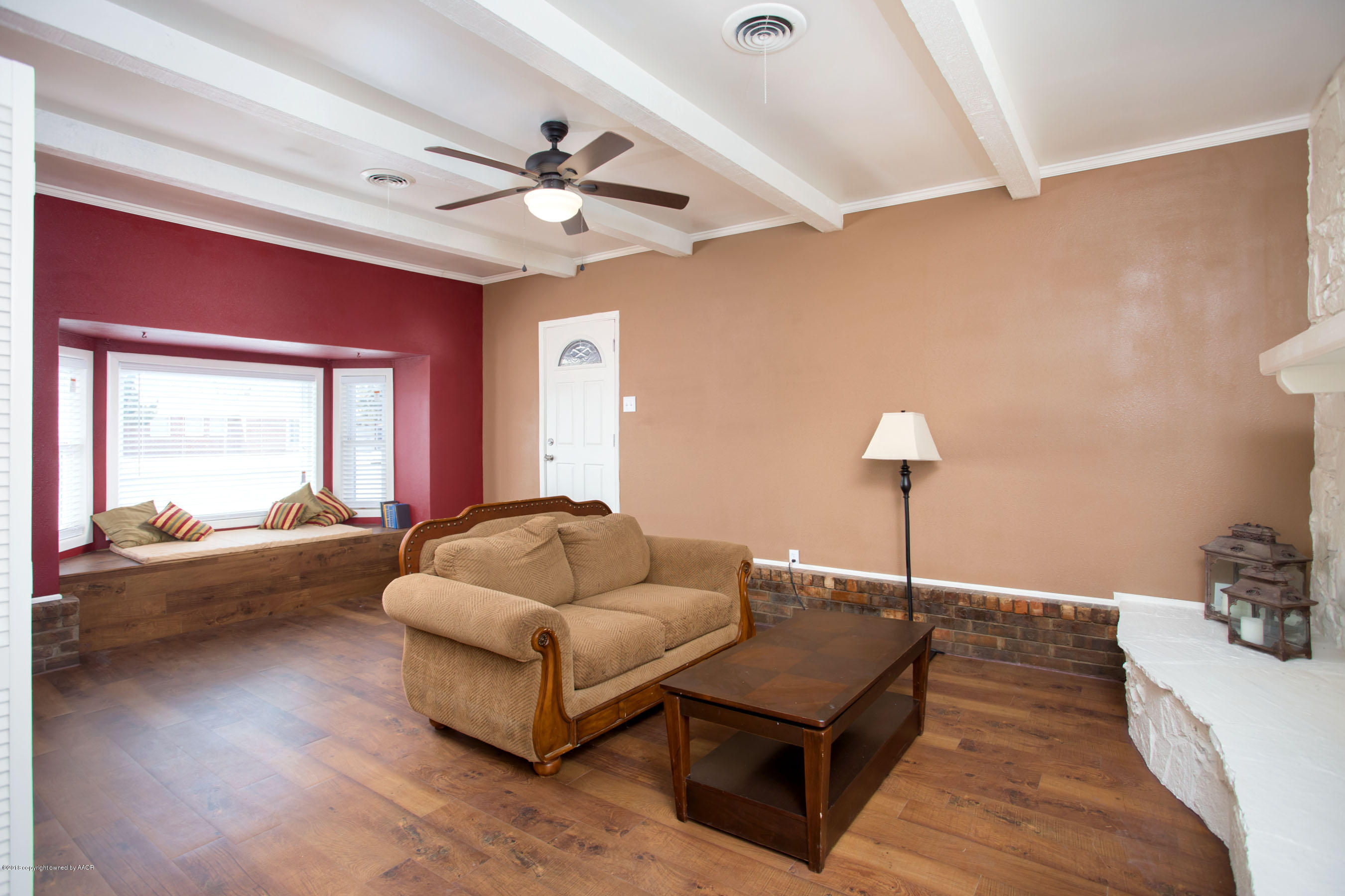 4609 South Bryan Street Amarillo, TX 79110 - Photo 13 of 26 a living room with furniture and a wooden floor