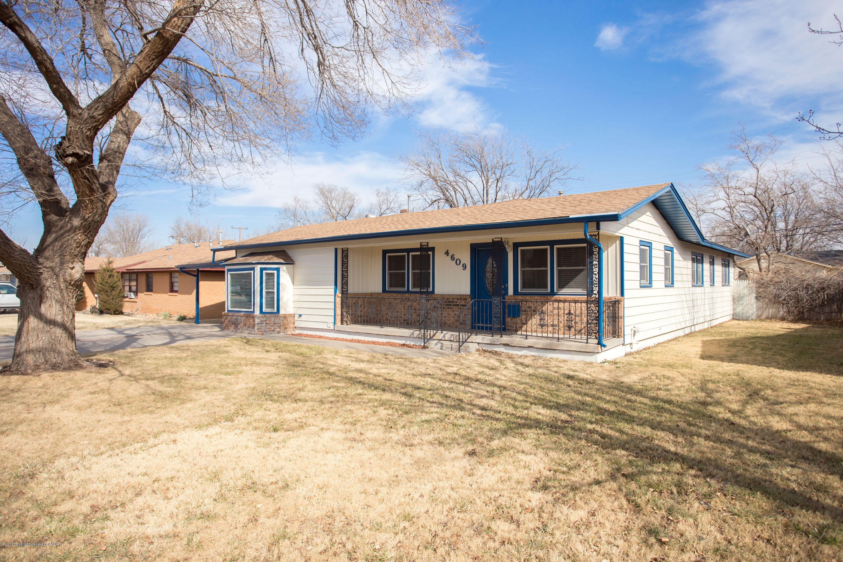 4609 South Bryan Street Amarillo, TX 79110 - Photo 4 of 26 a front view of a house with a yard covered in snow
