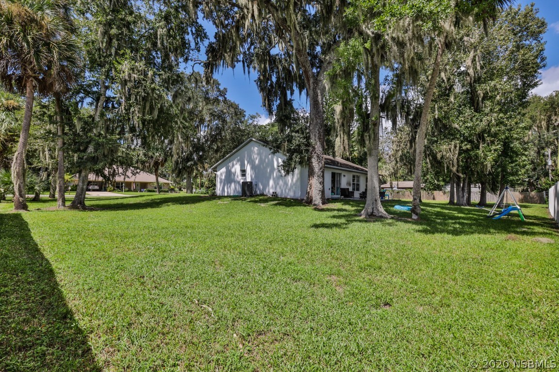 2103 Pine Tree Drive Edgewater, FL 32141 - Photo 5 of 26 a view of house with backyard