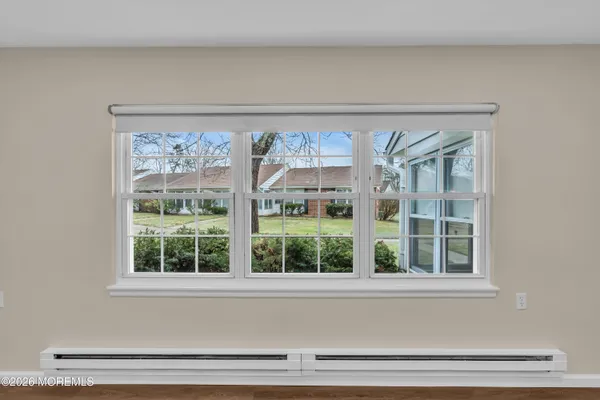 a front view of a house with a large window