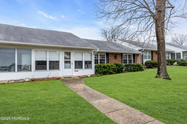 a front view of a house with a yard