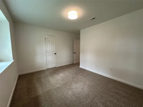 an empty room with an entryway
