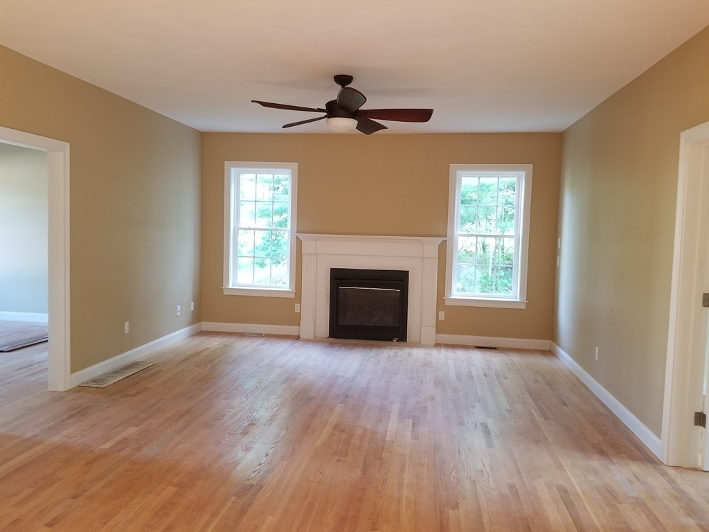 108 Robin Hill Road Groton, MA 01450 - Photo 12 of 24 a view of empty room with wooden floor and fan
