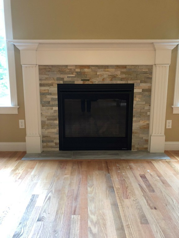 108 Robin Hill Road Groton, MA 01450 - Photo 13 of 24 a living room with a fireplace