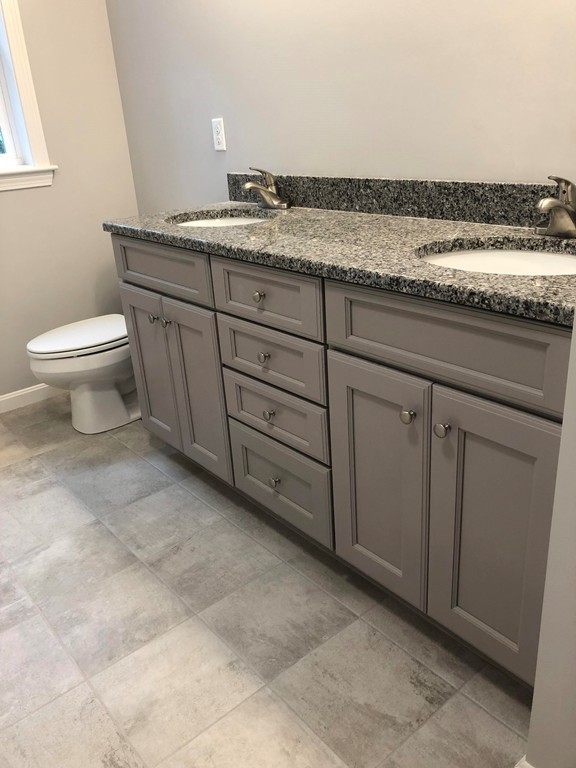 108 Robin Hill Road Groton, MA 01450 - Photo 17 of 24 a bathroom with a granite countertop sink and a toilet