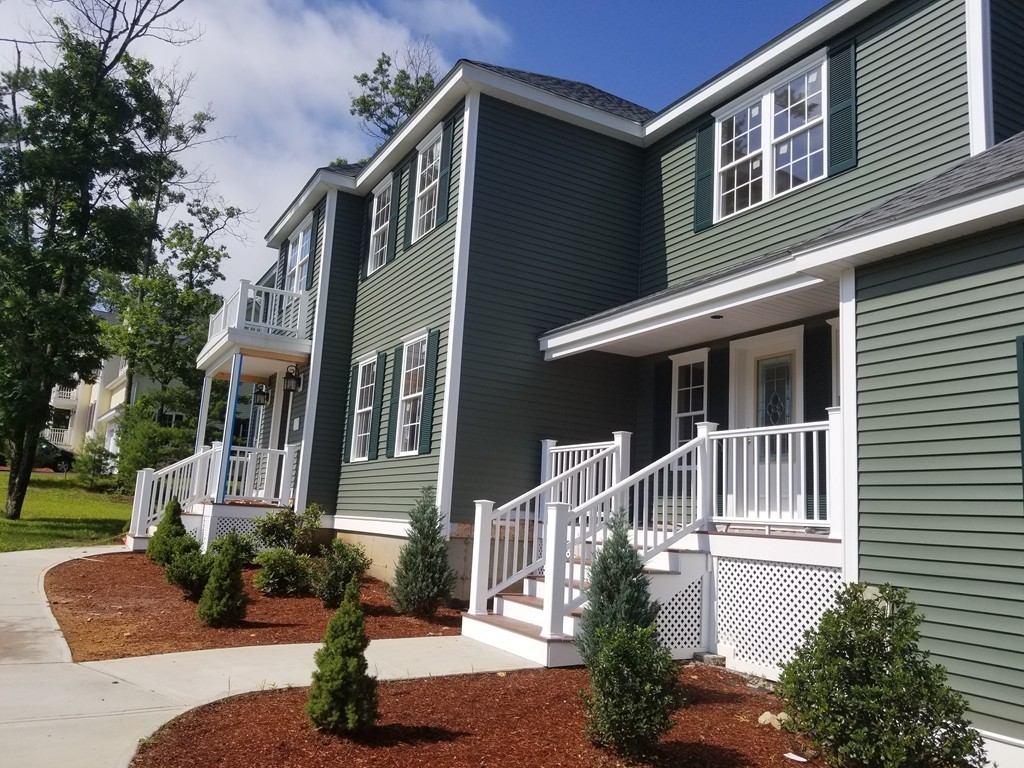 108 Robin Hill Road Groton, MA 01450 - Photo 3 of 24 a front view of a house with a yard