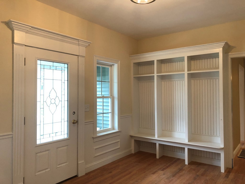 108 Robin Hill Road Groton, MA 01450 - Photo 4 of 24 an empty room with wooden floor and windows