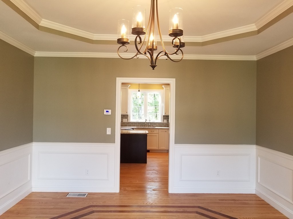 108 Robin Hill Road Groton, MA 01450 - Photo 6 of 24 a view of a livingroom with a chandelier