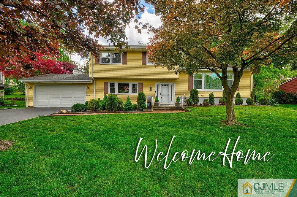 18 Bernard Road East Brunswick, NJ 08816 - Photo 1 of 1 a front view of a house with a garden