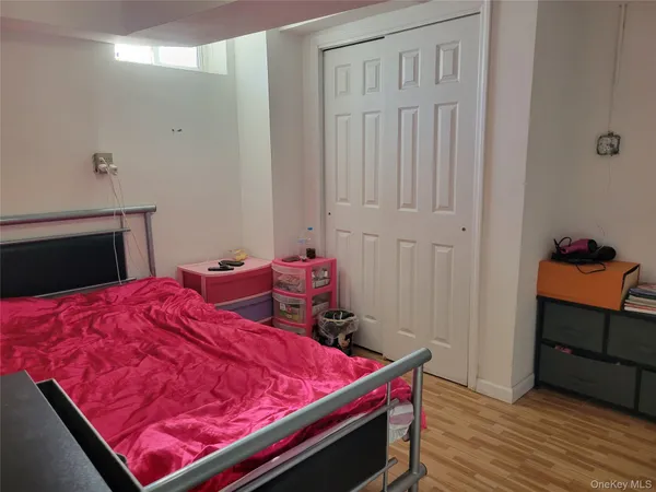 a bed room with a bed and a mirror