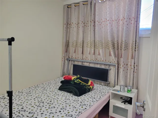 a bedroom with a bed and a fireplace