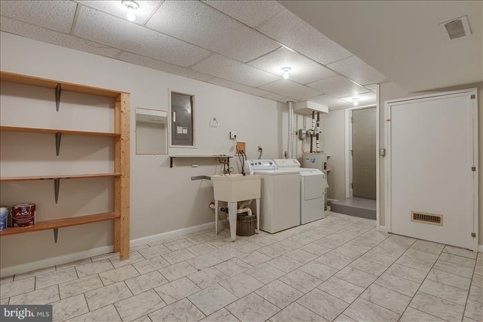 7525 Harmans Road Harmans, MD 21077 - Photo 20 of 30 Spacious Laundry Room with loads of storage