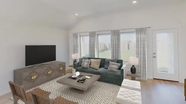 a living room with furniture and a flat screen tv