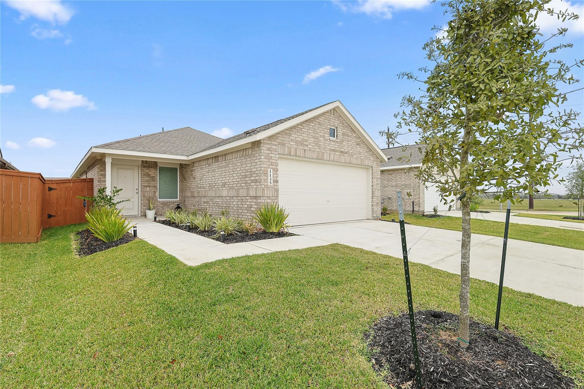 1135 Rustic Willow Drive Beasley, TX 77417 - Photo 2 of 20 a front view of a house with garden