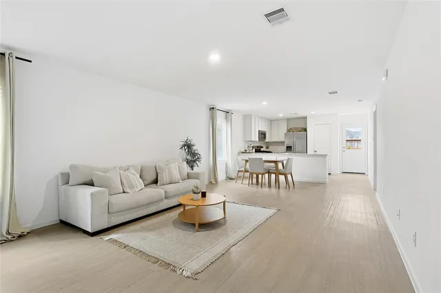 a living room with furniture and a table