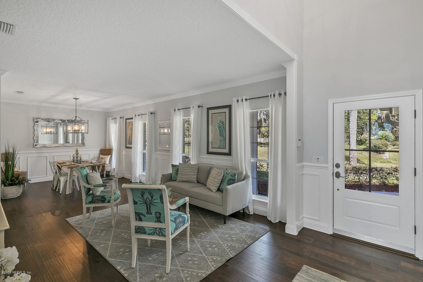 100 River's Edge Road North St. Augustine, FL 32092 - Photo 11 of 67 a living room with furniture and wooden floor next to a window