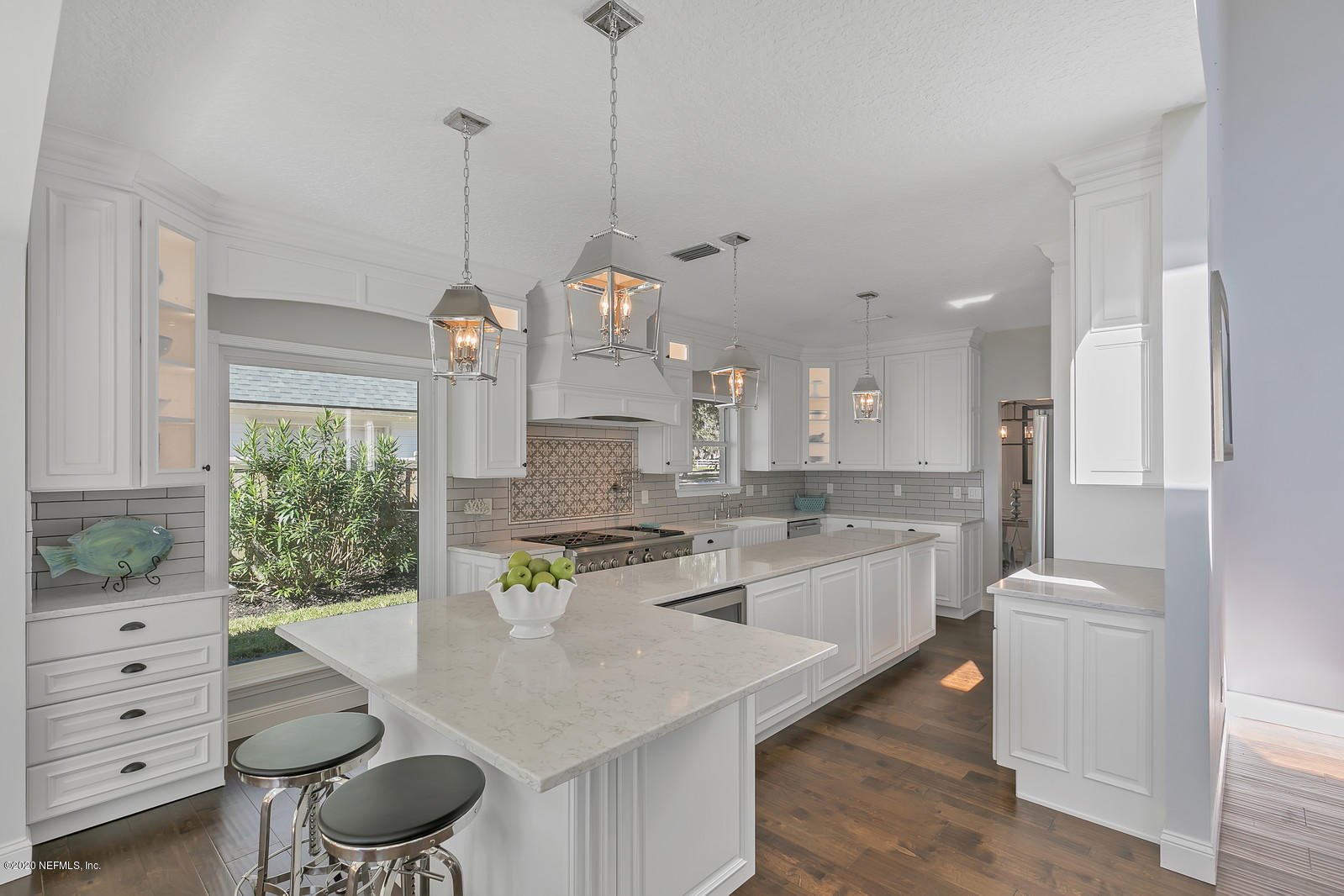 100 River's Edge Road North St. Augustine, FL 32092 - Photo 26 of 67 a large kitchen with kitchen island a table and chairs in it