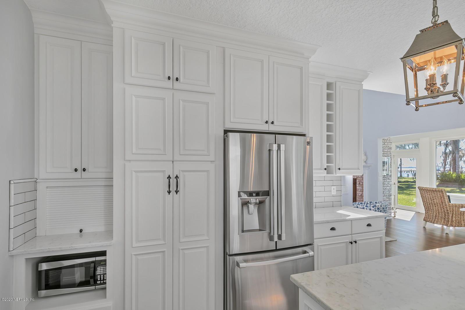 100 River's Edge Road North St. Augustine, FL 32092 - Photo 29 of 67 a kitchen with white cabinets and stainless steel appliances