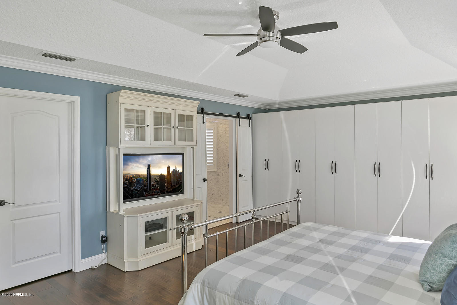 100 River's Edge Road North St. Augustine, FL 32092 - Photo 39 of 67 a bedroom with a bed and a flat screen tv