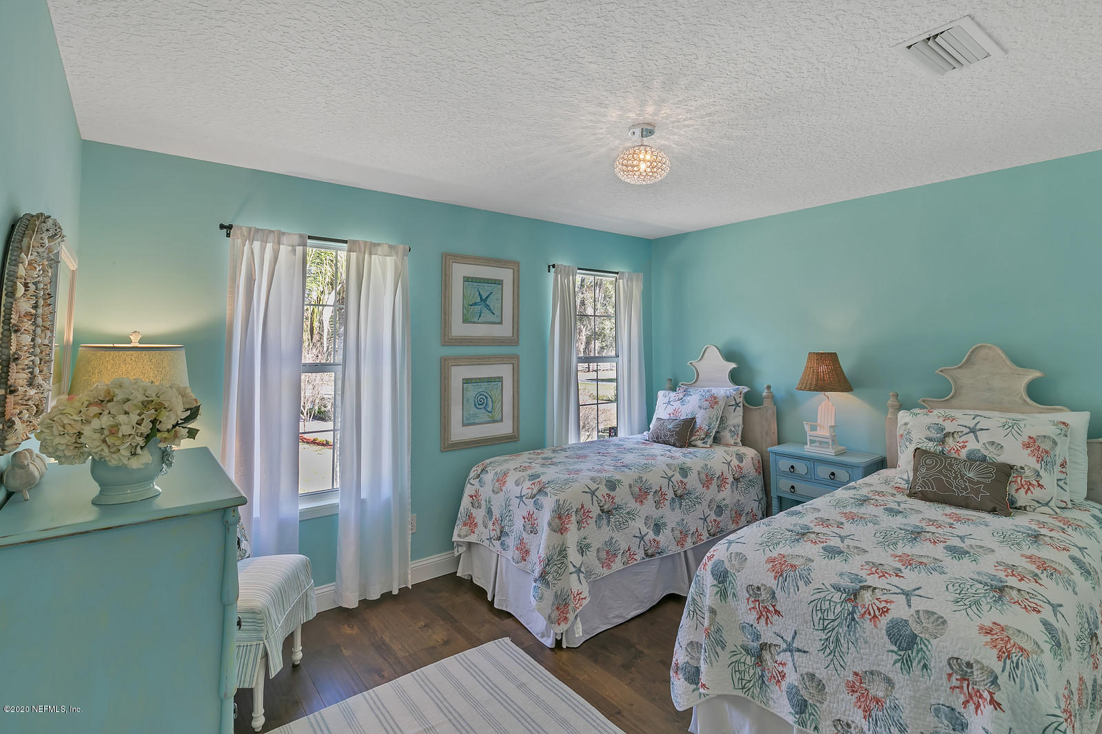 100 River's Edge Road North St. Augustine, FL 32092 - Photo 45 of 67 a bedroom with two beds and a potted plant
