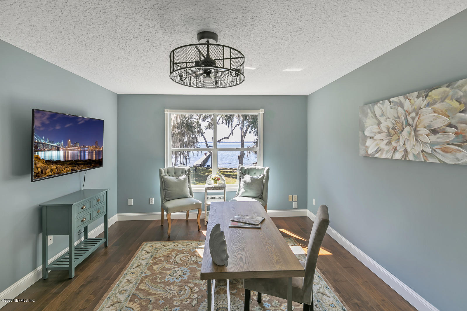 100 River's Edge Road North St. Augustine, FL 32092 - Photo 49 of 67 a view of a dining room with furniture a chandelier and wooden floor
